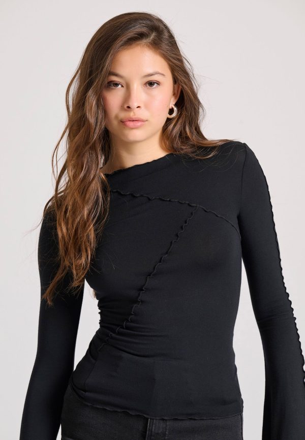 Top with decorative stitching and bell sleeves - Image 2