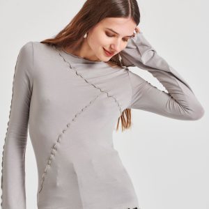 Top with decorative stitching and bell sleeves