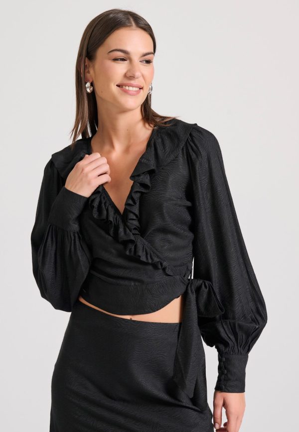 Wrapped top in jacquard weave with ruffles