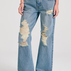 Women's loose fit jeans with destroyed effects