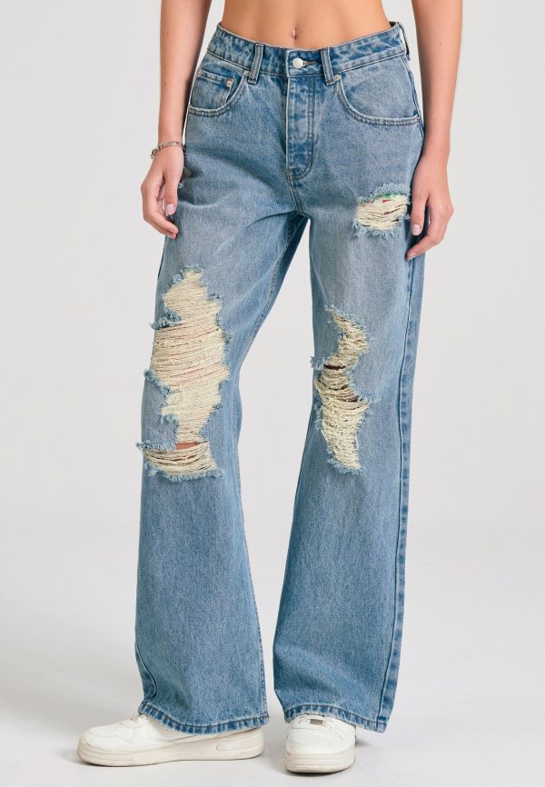 Women's loose fit jeans with destroyed effects